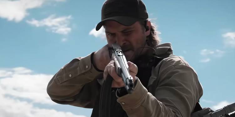 Kayce Dutton (Luke Grimes) holds a gun on 'Y: Marshals'