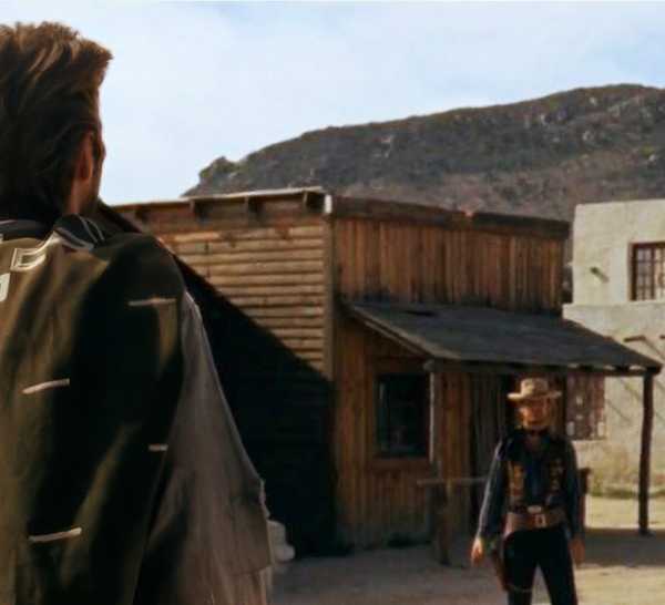 Clint Eastwood as the Man with No Name in the Mexican standoff in A Fistful of Dollars.