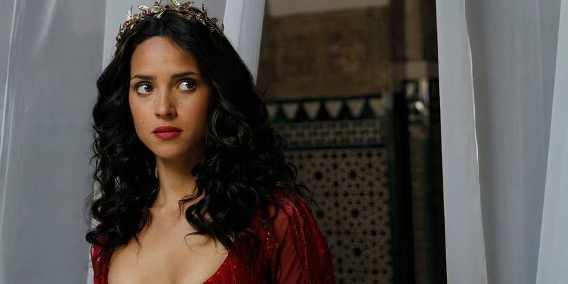 Adria Arjona looking worried in Emerald City.