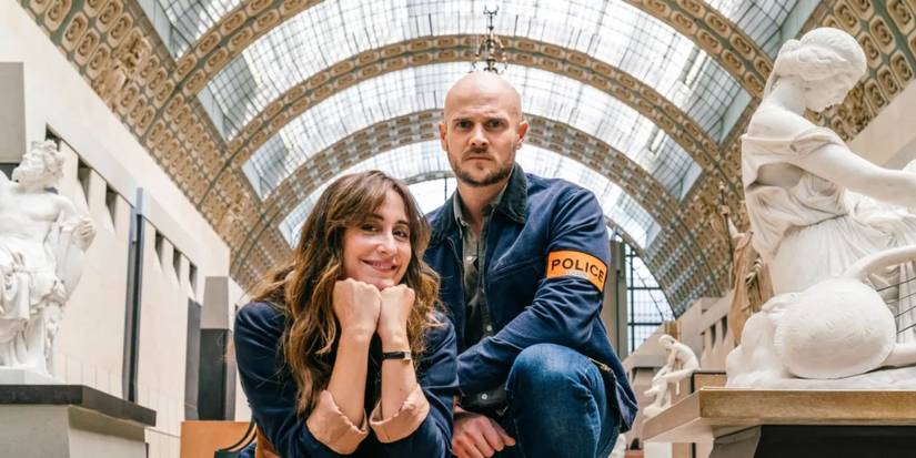 The promotional image of 'The Art of Crime' of two people looking at the camera inside a museum. 