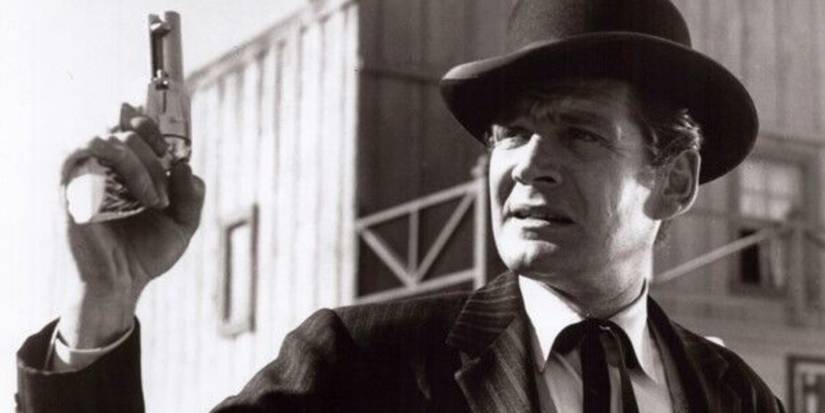 Gene Barry as Bat Masterson with a gun on 'Bat Masterson'.