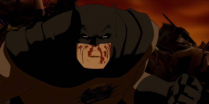 Batman standing bloodied and ready to fight in Batman: The Dark Knight Returns, Part 1
