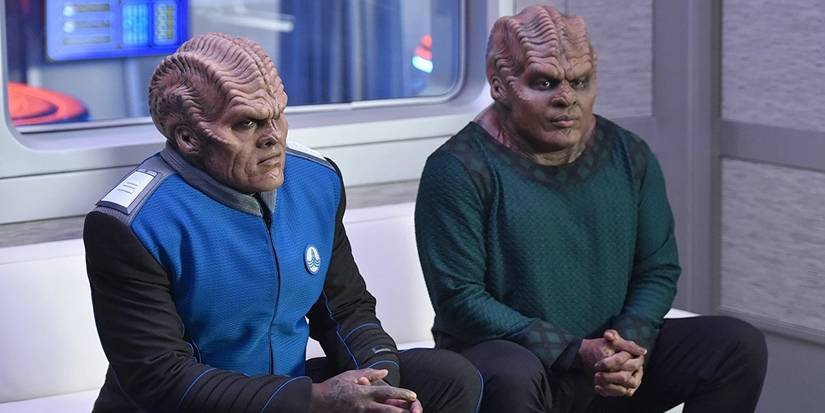 Bortus (Peter Macon) and Klyden (Chad Coleman) sitting together in The Orville.
