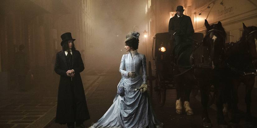 Dracula approaching a woman in a white gown near a horse-drawn carriage.