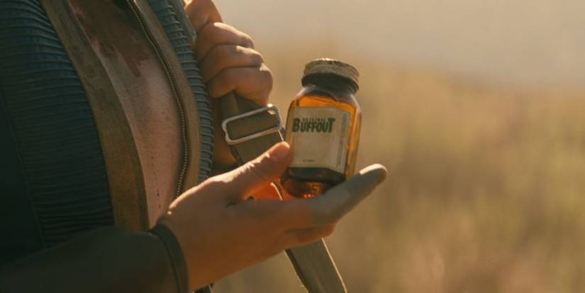 Lucy MacLean (Ella Purnell) holding a bottle of Buffout in 'Fallout'