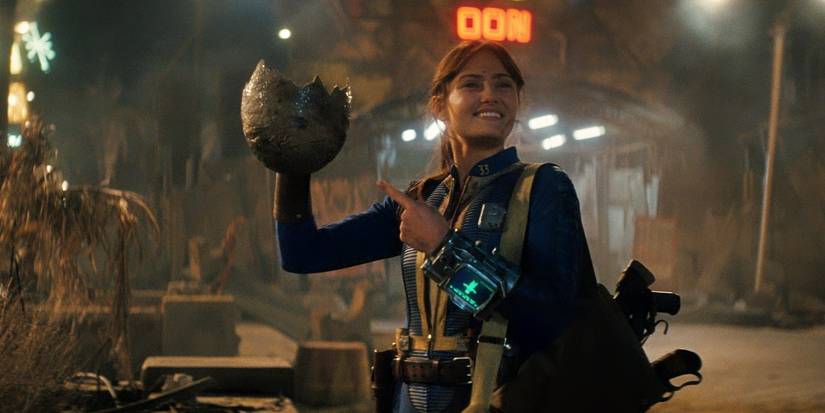 Ella Purnell holding a Deathclaw egg in Fallout Season 2 Episode 4