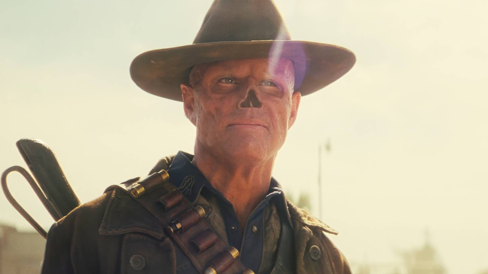 Fallout's Walton Goggins as the Ghoul smirking in the desert wasteland