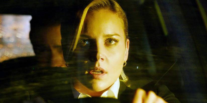 Secret service agent looking out the windshield of a car