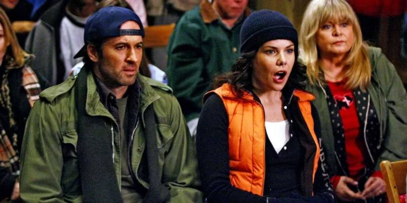 Luke (Scott Patterson) and Lorelai (Lauren Graham) at a town hall meeting in 'Gilmore Girls'.