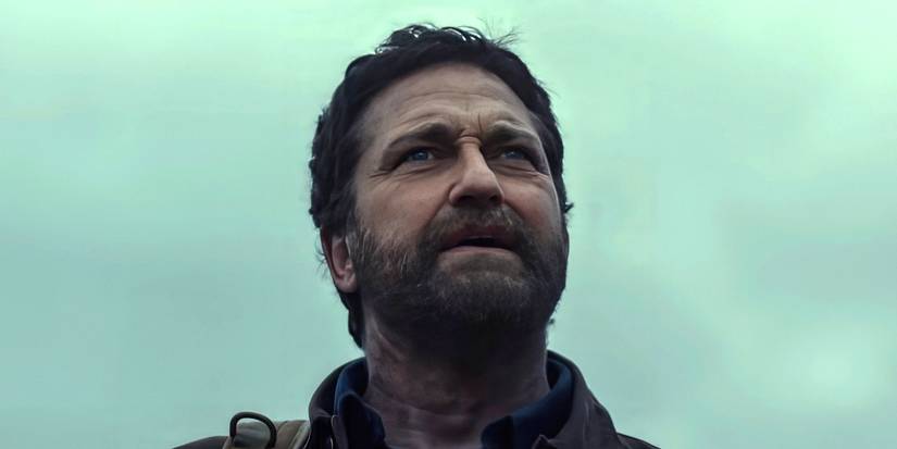 Gerard Butler looks up, concerned, in Greenland 2: Migration