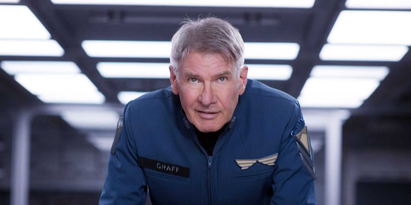 Harrison Ford in uniform, staring ahead with excitement in Ender's Game.