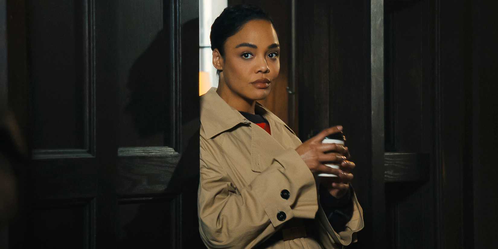 Tessa Thompson's Anna standing in the doorway in His & Hers