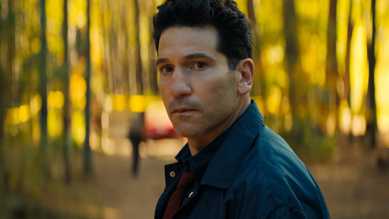 Jon Bernthal's Jack looking panicked in the woods in His & Hers