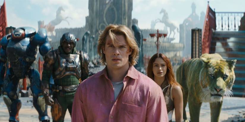 Idris Elba as Man at Arms, Nicholas Galitzine as Prince Adam, and Camila Mendes as Teela in Masters of the Universe.