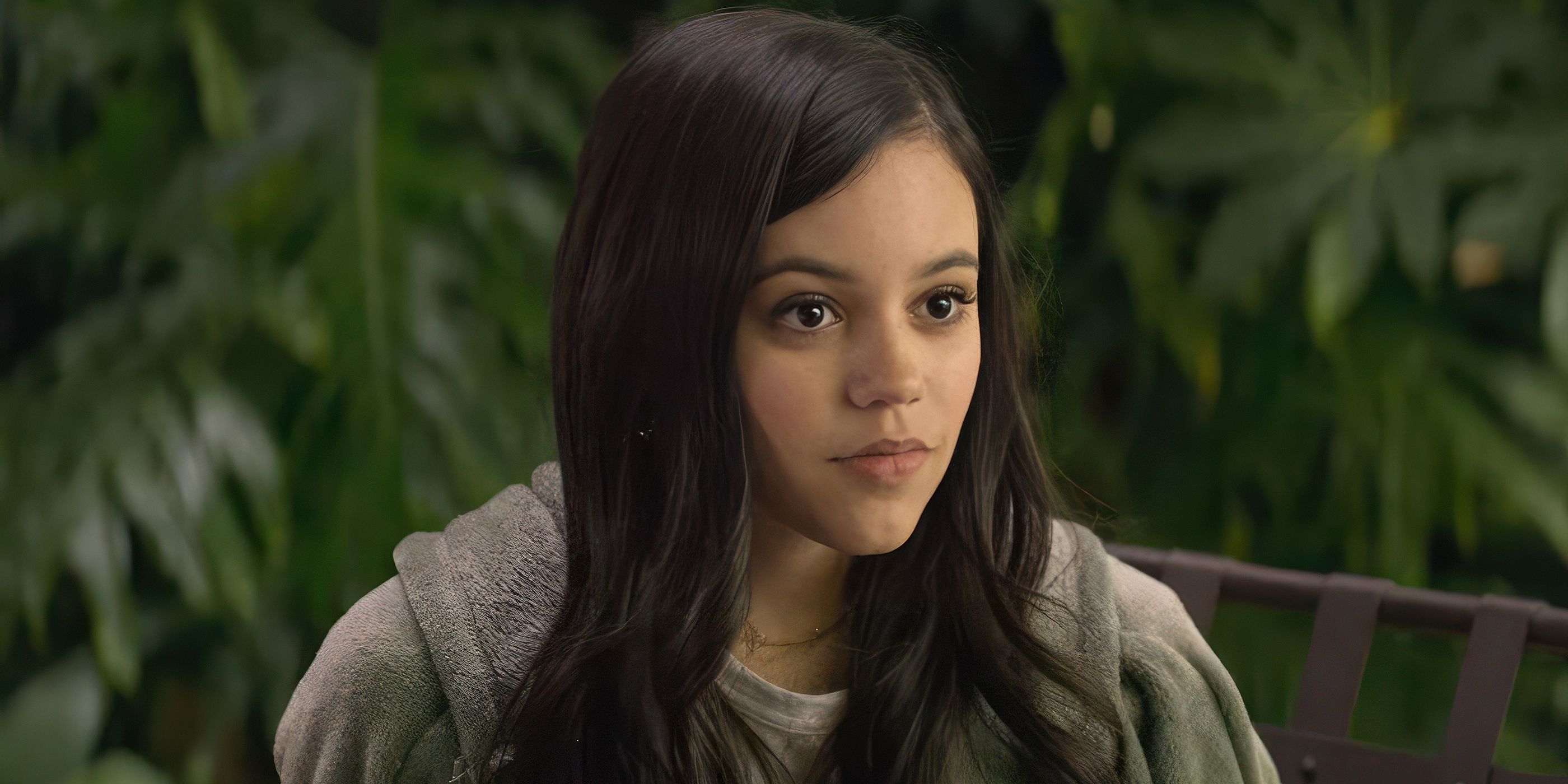 Jenna Ortega smiling and looking ahead in You