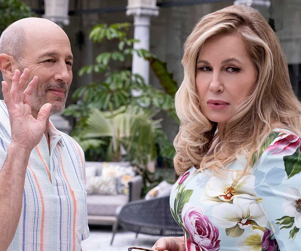 Jennifer Coolidge in a floral dress in 'The White Lotus'