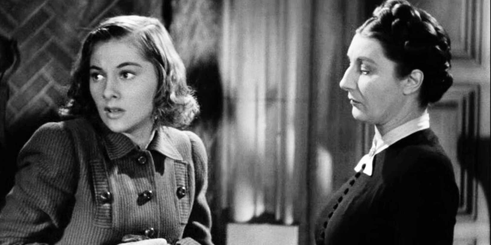 Judith Anderson looking at a nervous Joan Fontaine in Rebecca (1940)