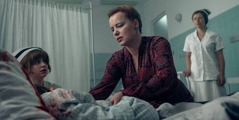 Joanna Kulig as Dr. Jolanta Wadowska-Król inspecting a sick child in 'Lead Children'