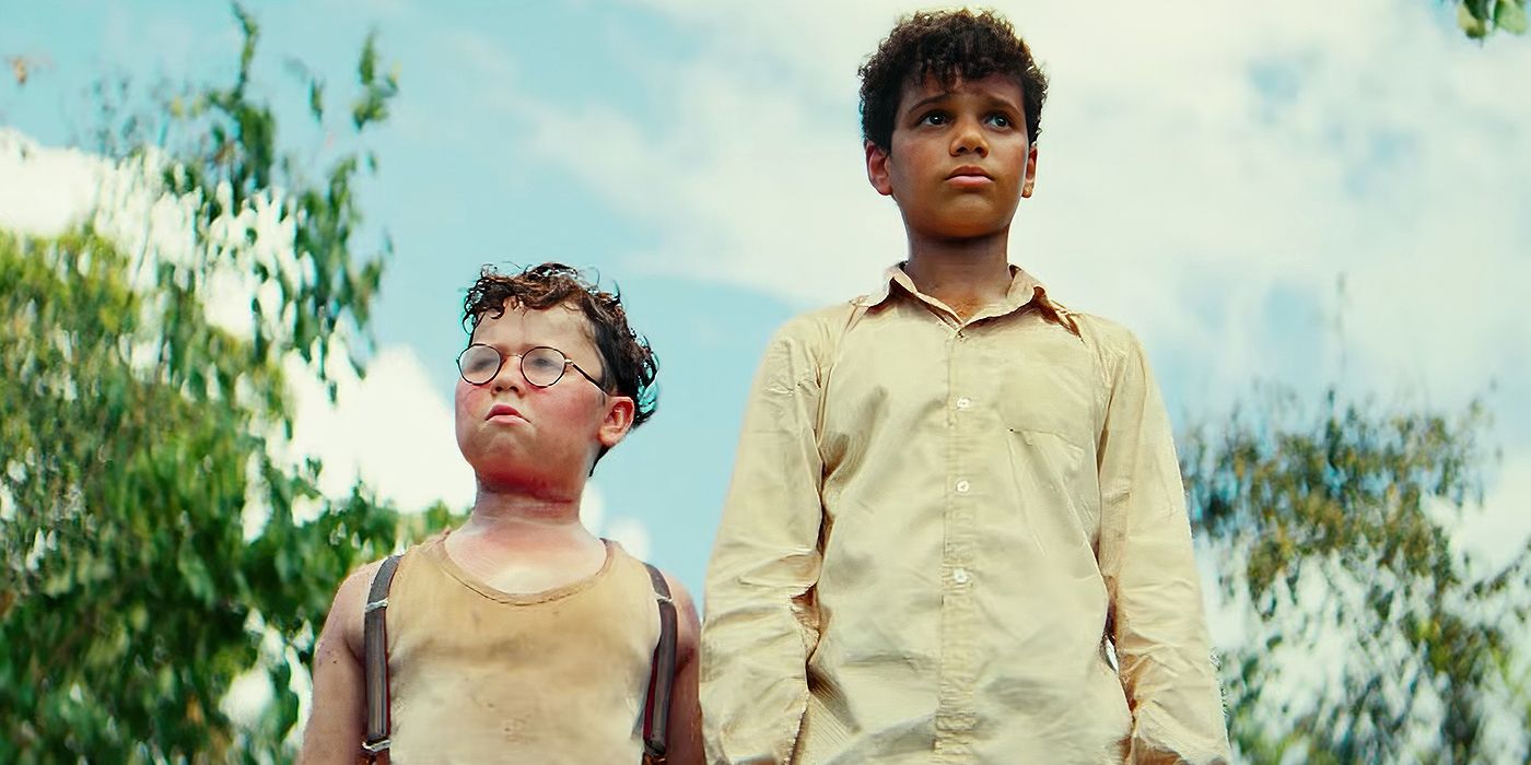 Two shipwrecked boys stand next to one another in 'Lord of the Flies' image