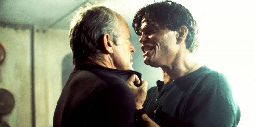 Lance Henriksen as David manhandled by Jeff Kober as Dazinger in Lost Voyage.