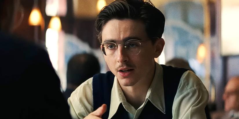 Timothee Chalamet as Marty Supreme having a meeting in a restaurant