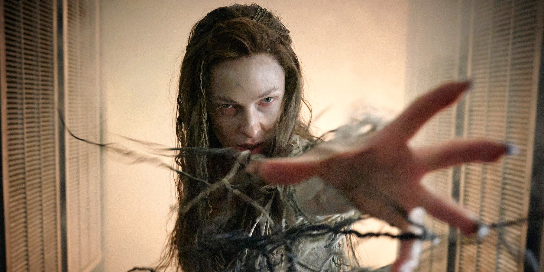 Rebecca Ferguson as a witch with her arm outstretched in Kid Who Would Be King