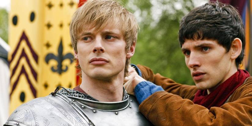 Merlin (Colin Morgan) and Arthur (Bradley James) looking in the same direction in Merlin.