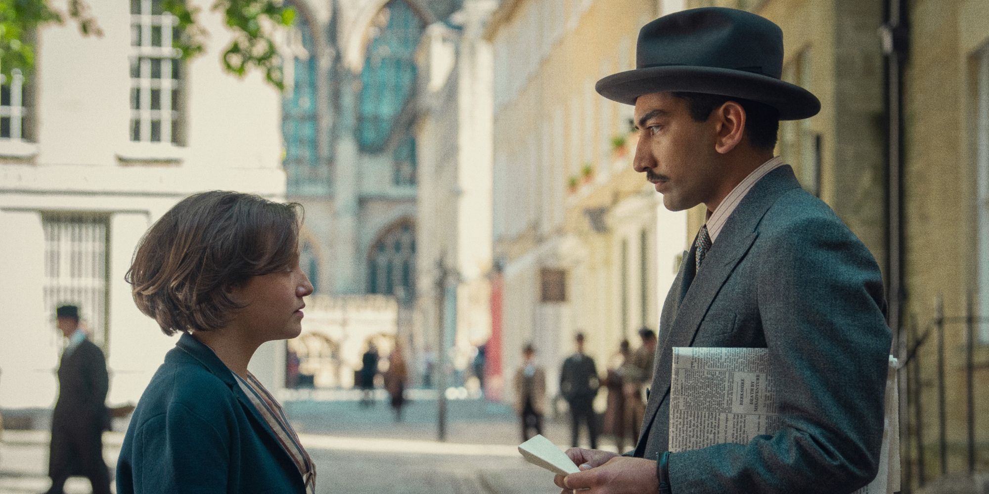 Mia McKenna-Bruce and Nabhaan Rizwan face each other on a street in Agatha Christie's Seven Dials.