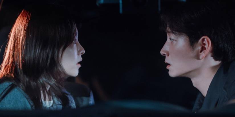 Park Bo-young and Lee Hyun-wook looking at each other in Gold Land.