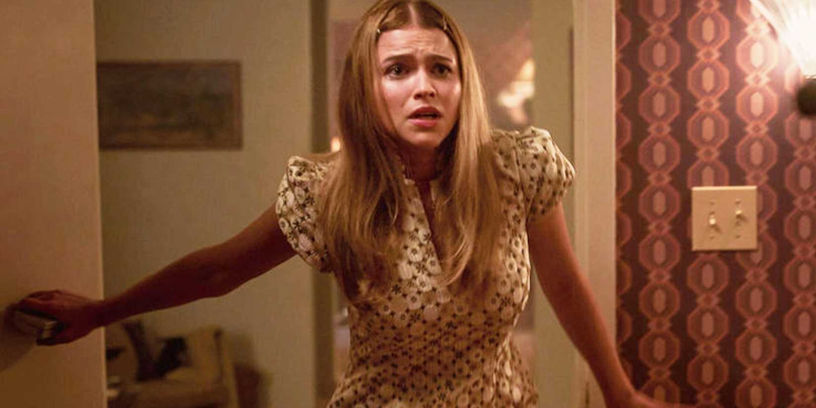 Clare Hughes as Eevi looking worried inside a house in Ponies.