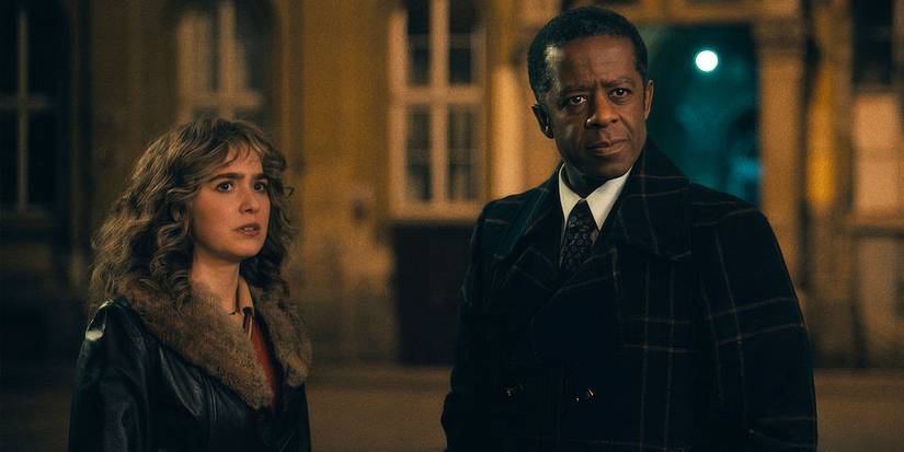 Haley Lu Richardson as Twila and Adrian Lester as Dane looking concerned in the same direction in Ponies.