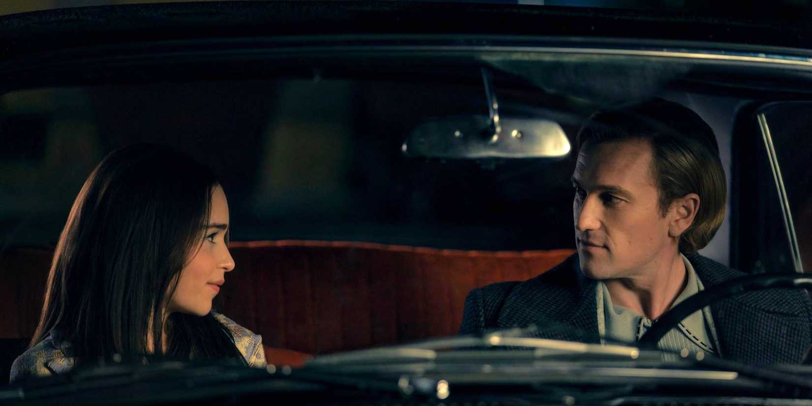 Emilia Clarke as Beatrice sits in a car with Artjom Gilz as Andrei in Ponies.