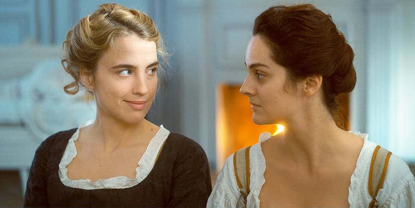 Noémie Merlant and Adèle Haenel looking at each other in Portrait of a Lady on Fire.