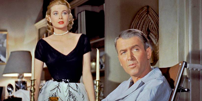 Grace Kelly and James Stewart look in the same direction in Rear Window.