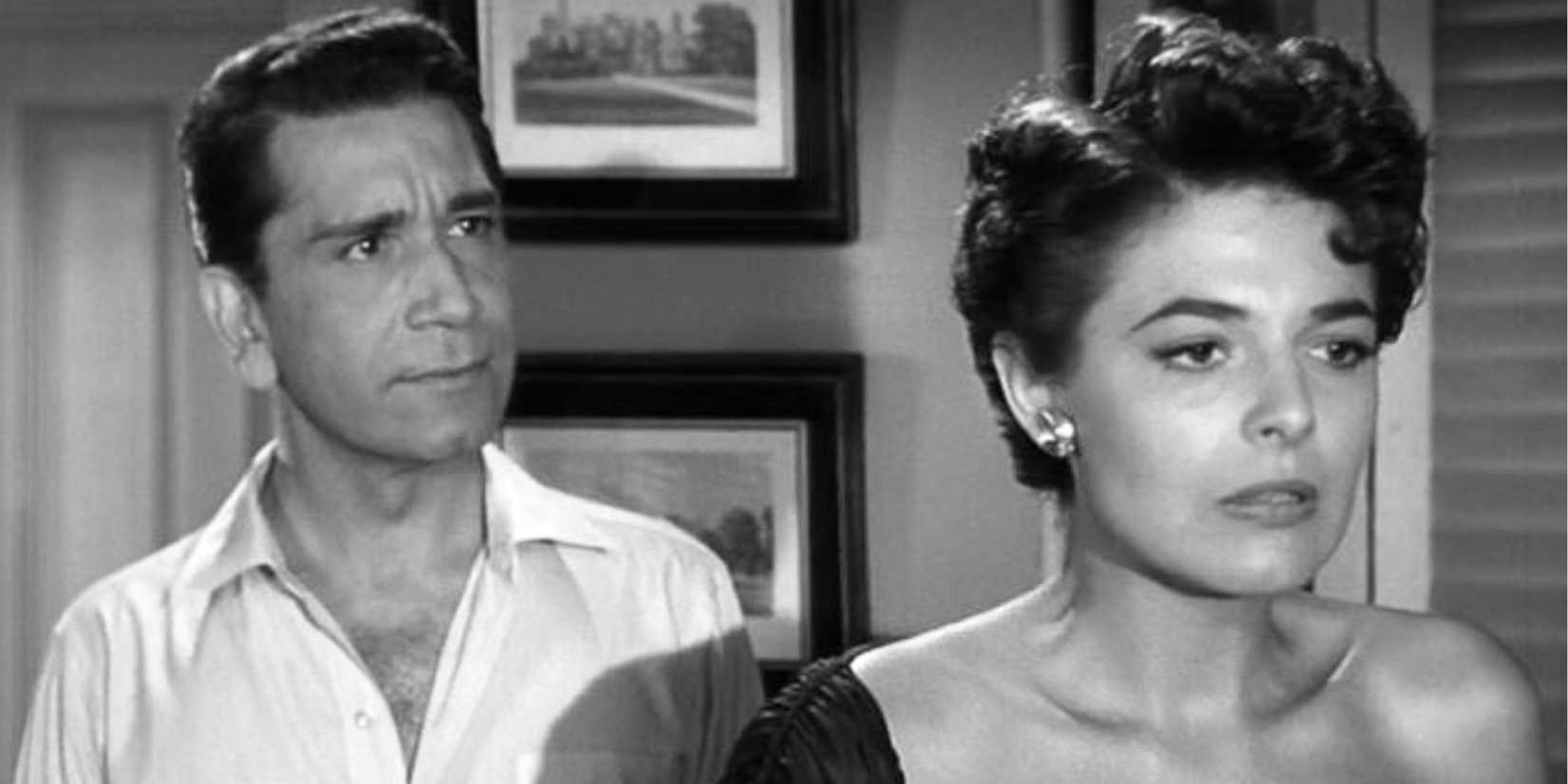 Richard Conte standing behind Anne Bancroft in New York Confidential (1955)