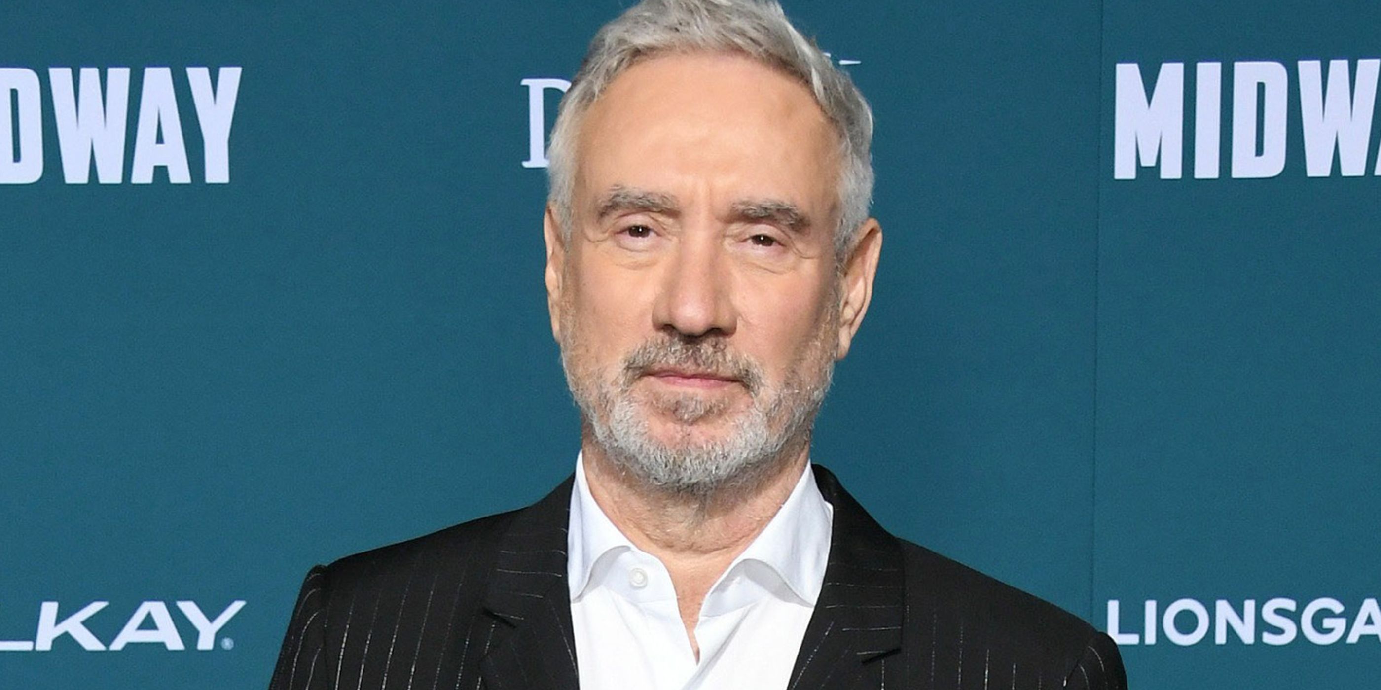 Roland Emmerich poses on the red carpet
