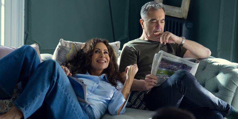 Minnie Driver as Ingrid and James Nesbitt as Simon sit on the couch in 'Run Away.'