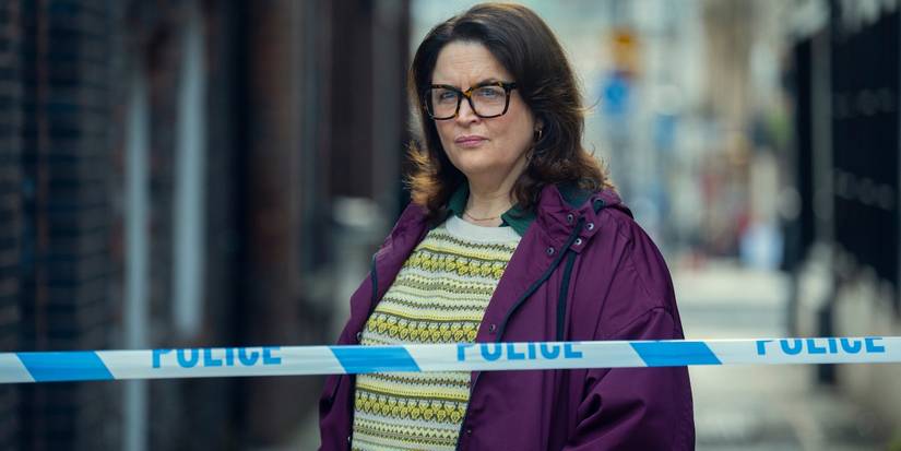 Ruth Jones as Elena Ravenscroft standing behind police tape in 'Run Away.'