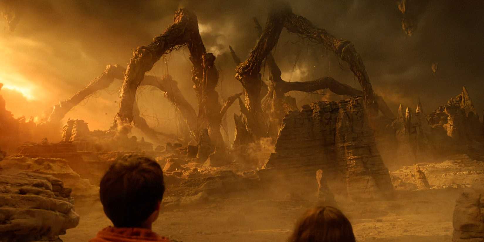 Will and Joyce look at the Mind Flayer in its spider monster form in the Stranger Things finale.