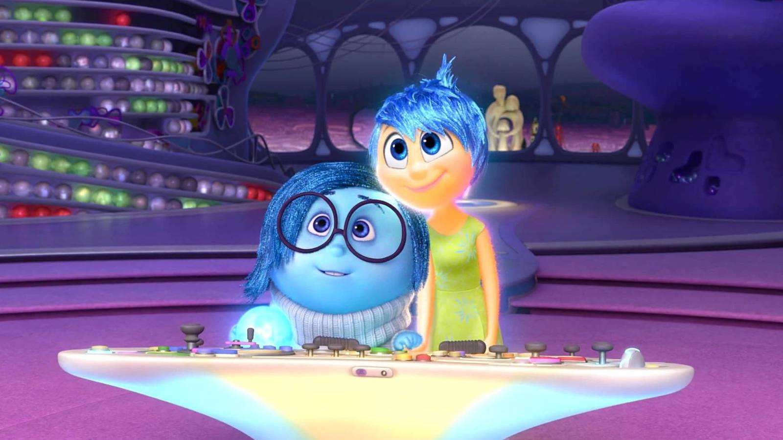 Sadness and Joy smiling at the console in 'Inside Out'