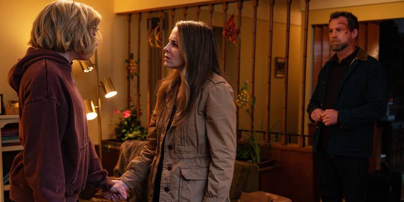 Sandra holds Maddie's hand and looks at her with concern.