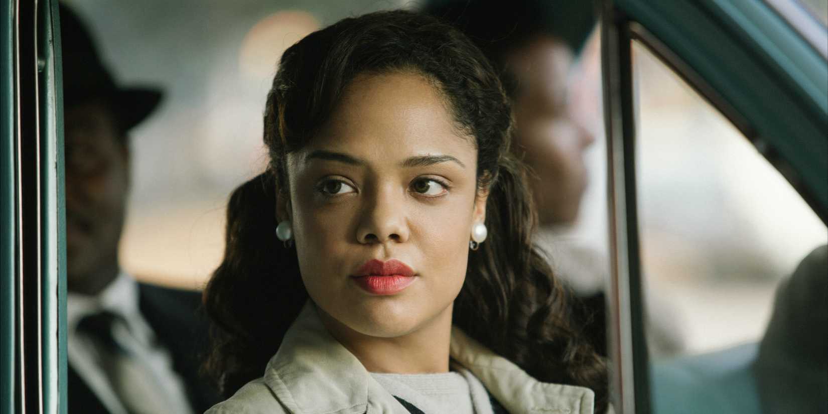 Tessa Thompson as Diane Nash sitting in a car and looking outside in Selma.