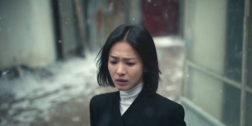 Song Hye-kyo looking at something off-screen with a confused look on her face in The Glory