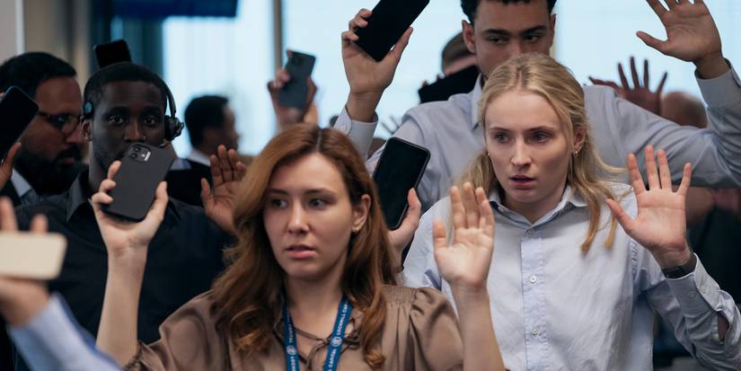 Sophie Turner as Zara with her hands up during a robbery in Steal