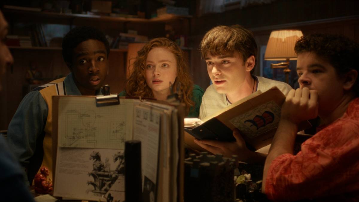 Lucas, Max, Will, and Dustin listen as Mike leads the last D&D campaign on 'Stranger Things.'