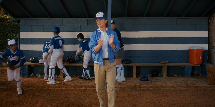 Steve coaching a kids' baseball team in Stranger Things.