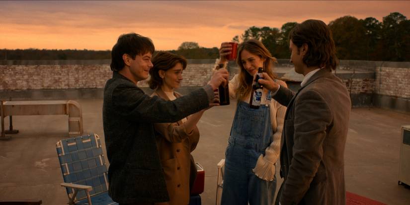 Jonathan, Nancy, Robin, and Steve toast during the finale of 'Stranger Things.'