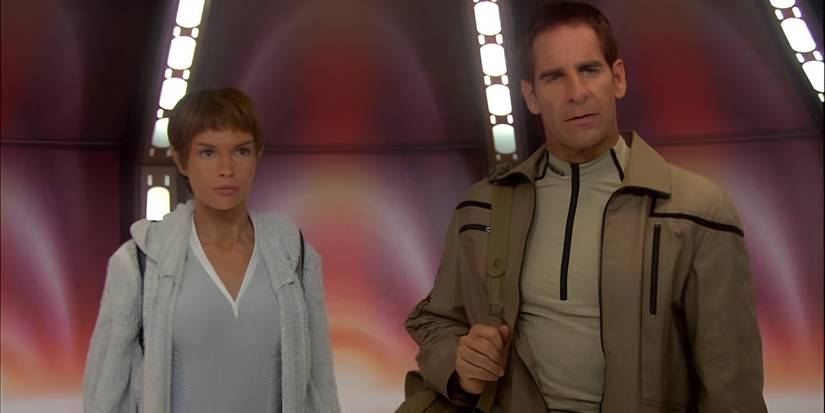 T'Pol (Jolene Blalock) and Archer (Scott Bakula), standing together in casual wear in the Star Trek: Enterprise episode "The Forge."