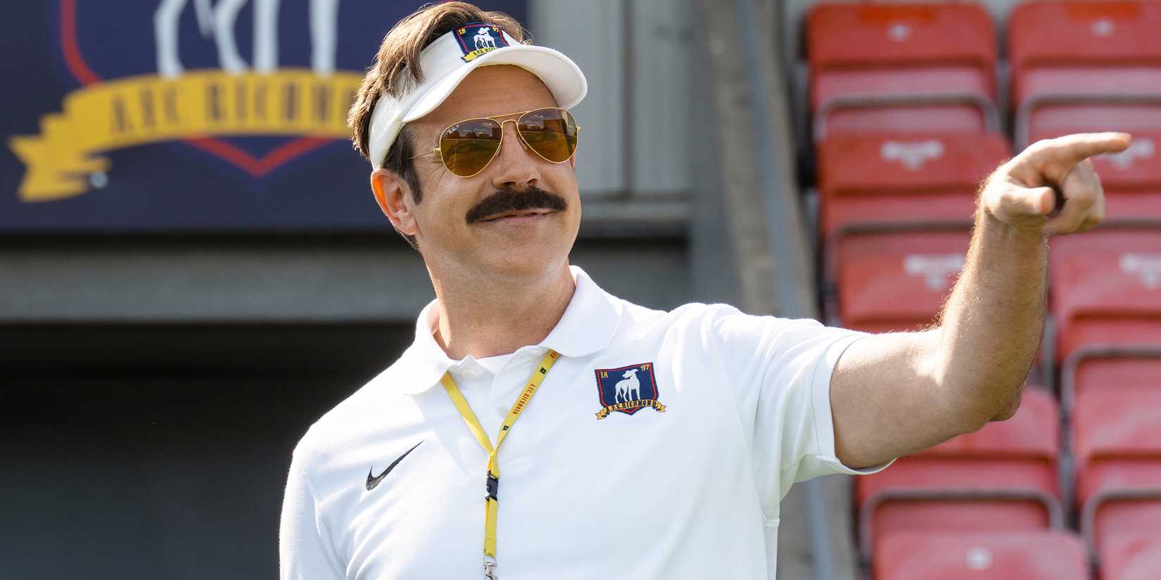 Jason Sudeikis smiling and pointing as Ted in Ted Lasso Season 4