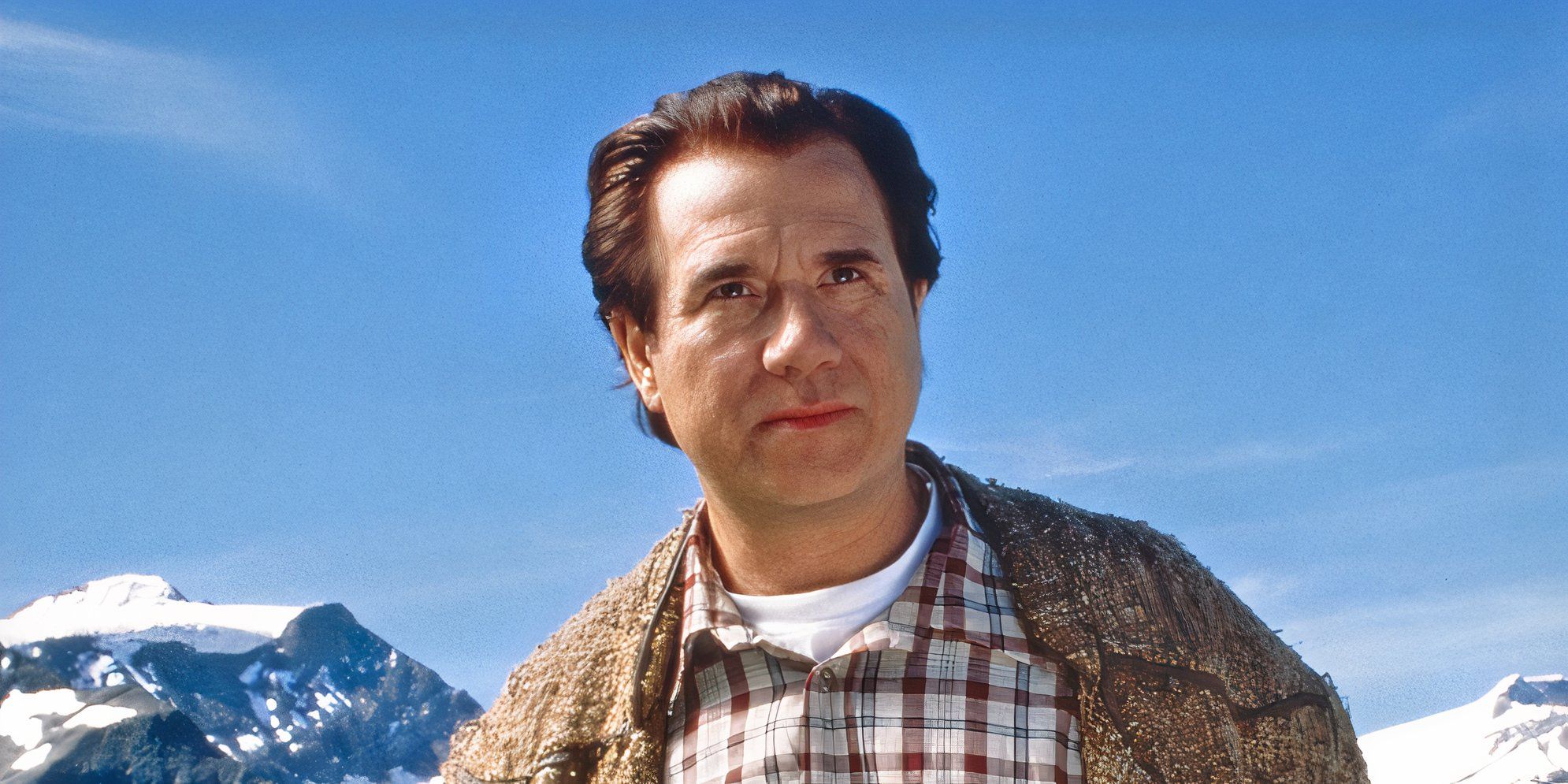 John Larroquette as Tony on a snowy mountain looking ahead in The 10th Kingdom.